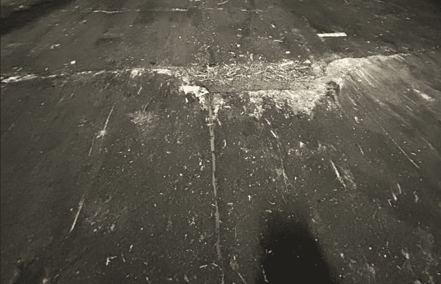 Surface has delaminated on the surface of the concrete because of failed joint